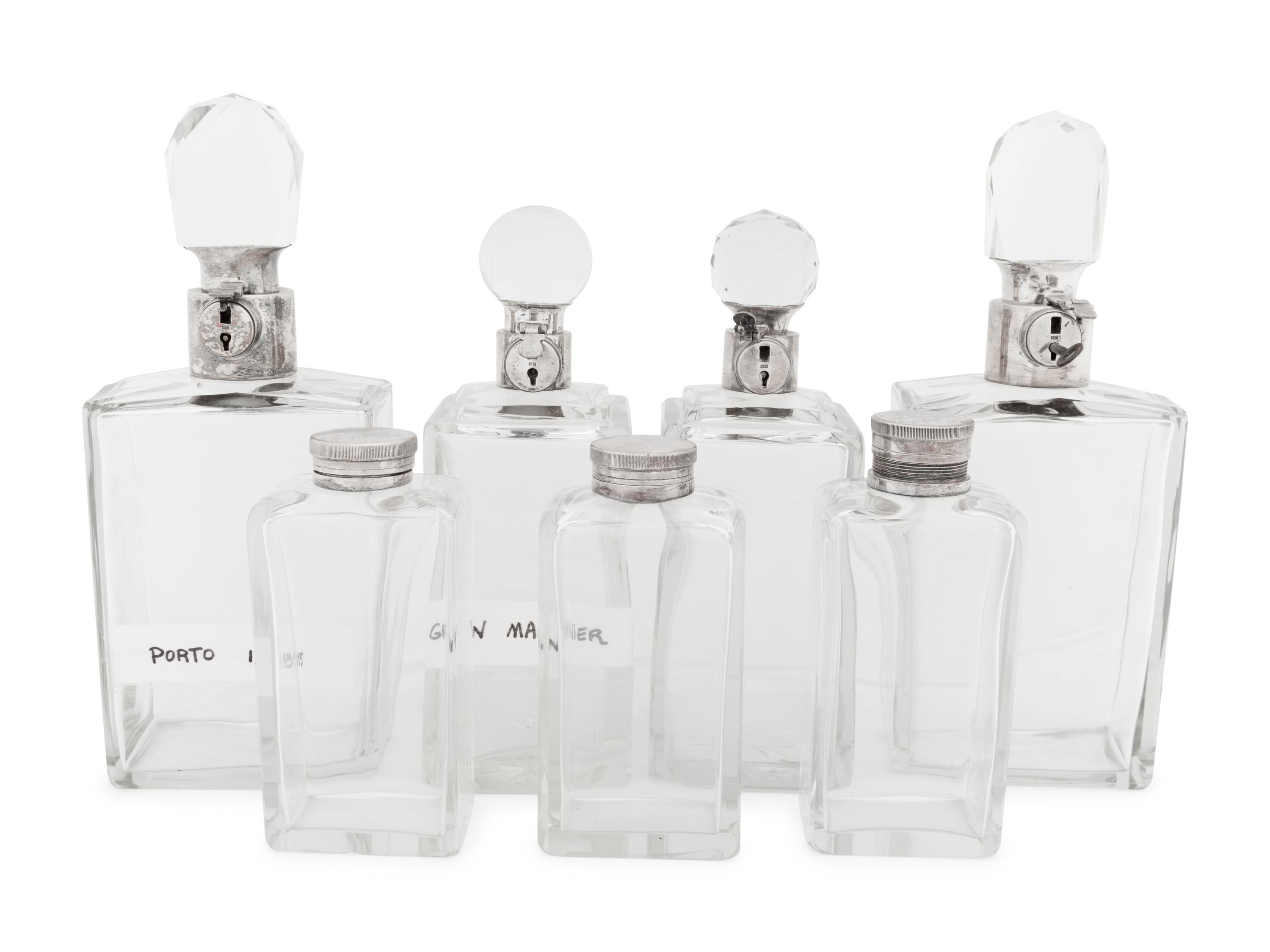 Seven Silver and Silver-Plate Mounted Glass Decanters