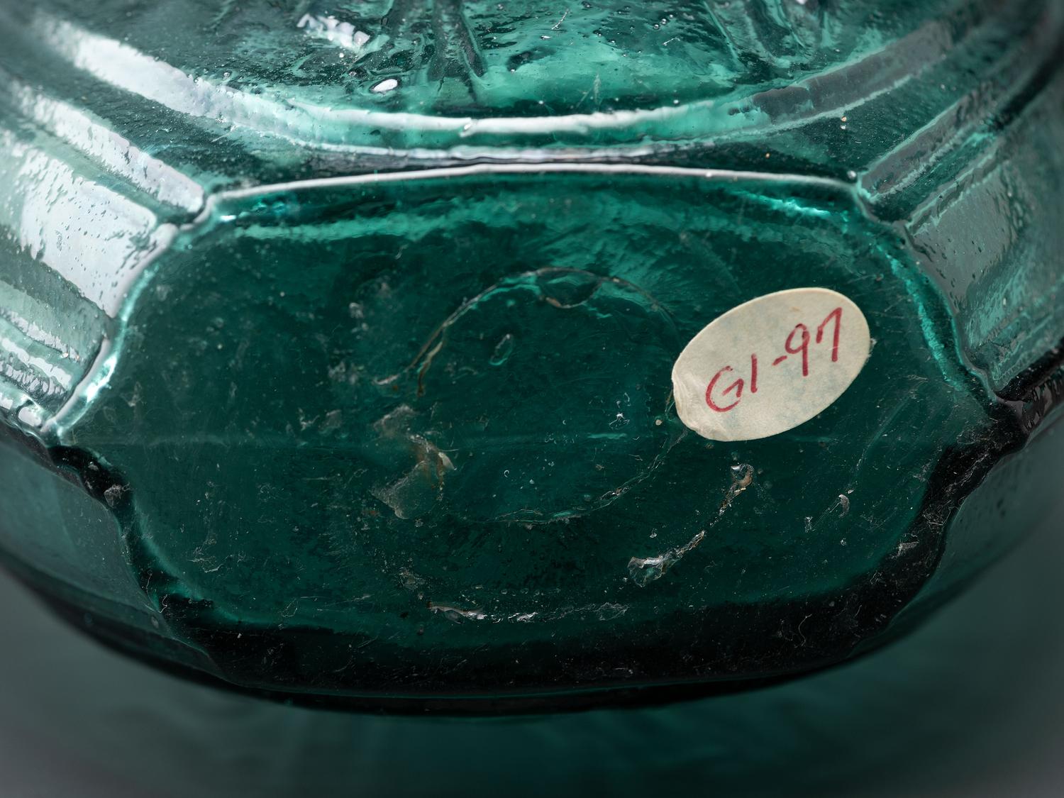 A Benjamin Franklin Portrait Flask in Green Glass by Kensington Glass Works, Philadelphia