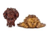 A Carved Oak Devil's Mask with a Giltwood Cherub Mask