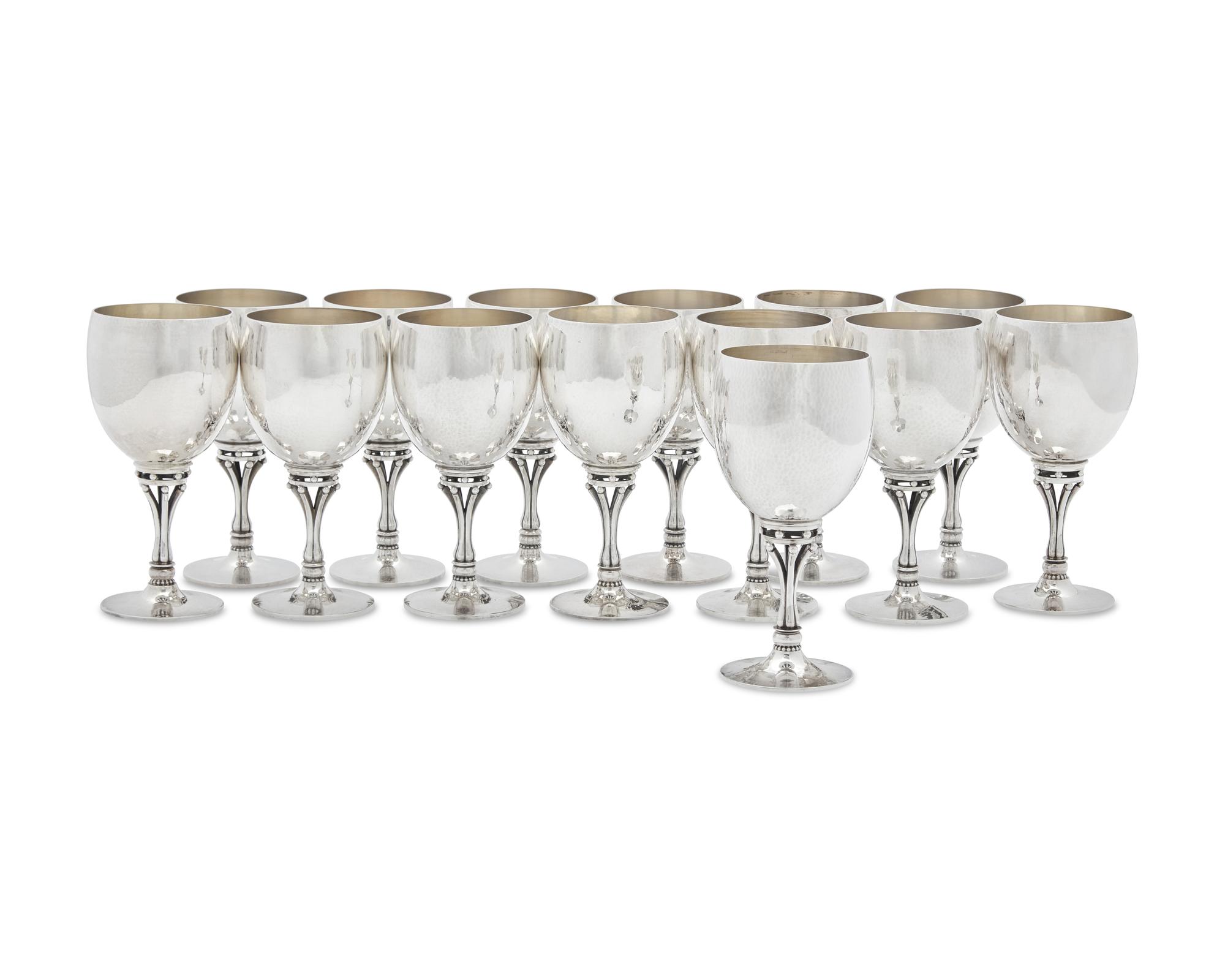 A Set of Fourteen Harald Nielsen Designed Georg Jensen Silver Goblets