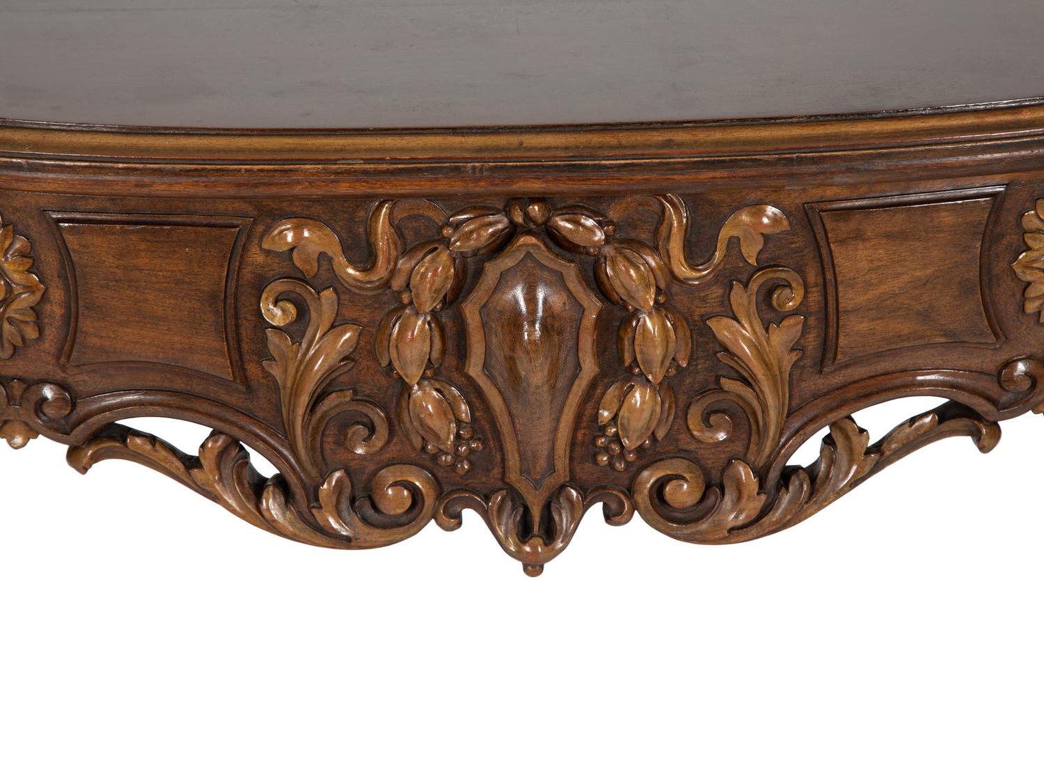 A Continental Carved and Parcel Gilt Console Table