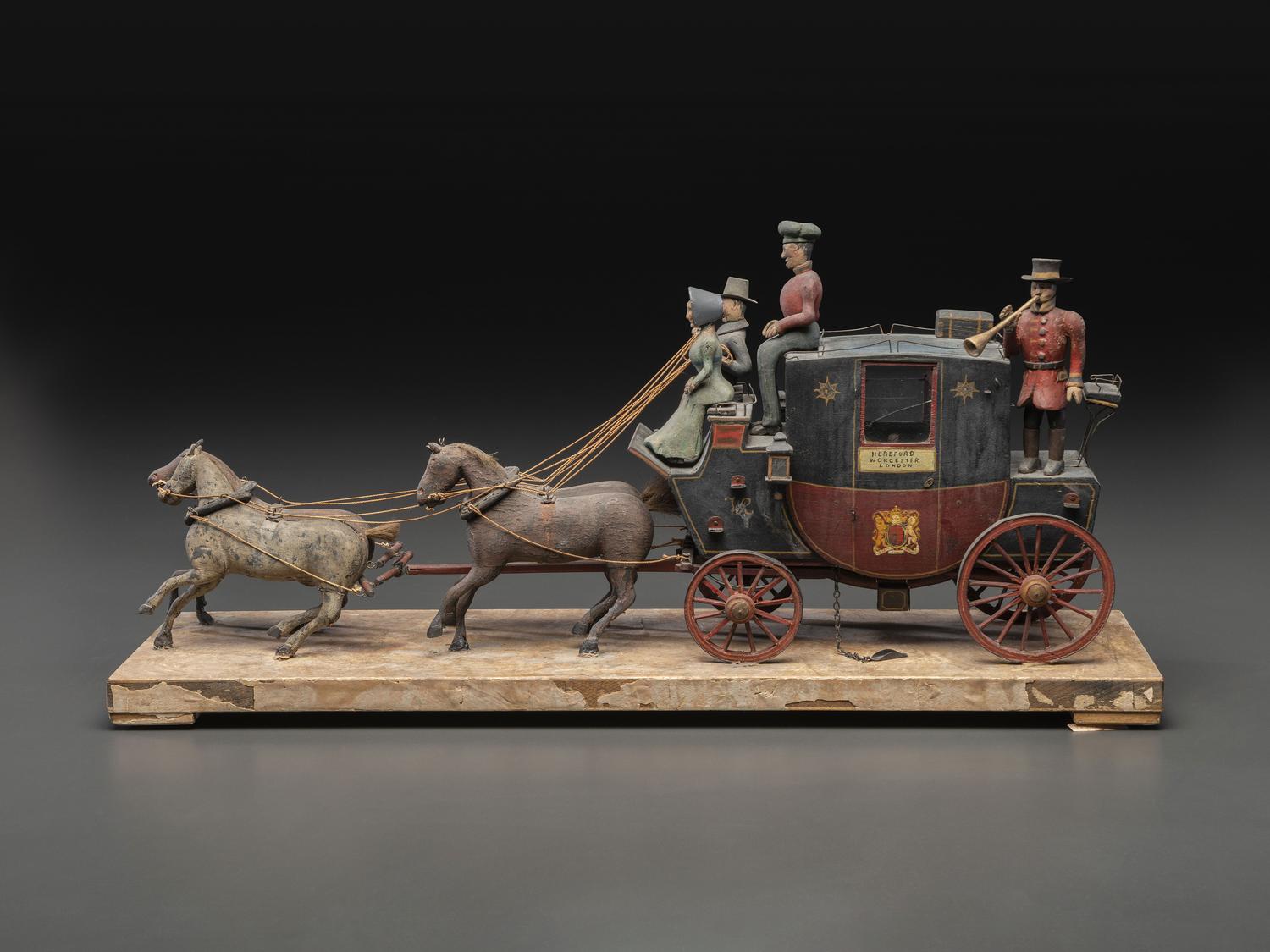 A Folk Art Carved and Painted Wood English Royal Stagecoach