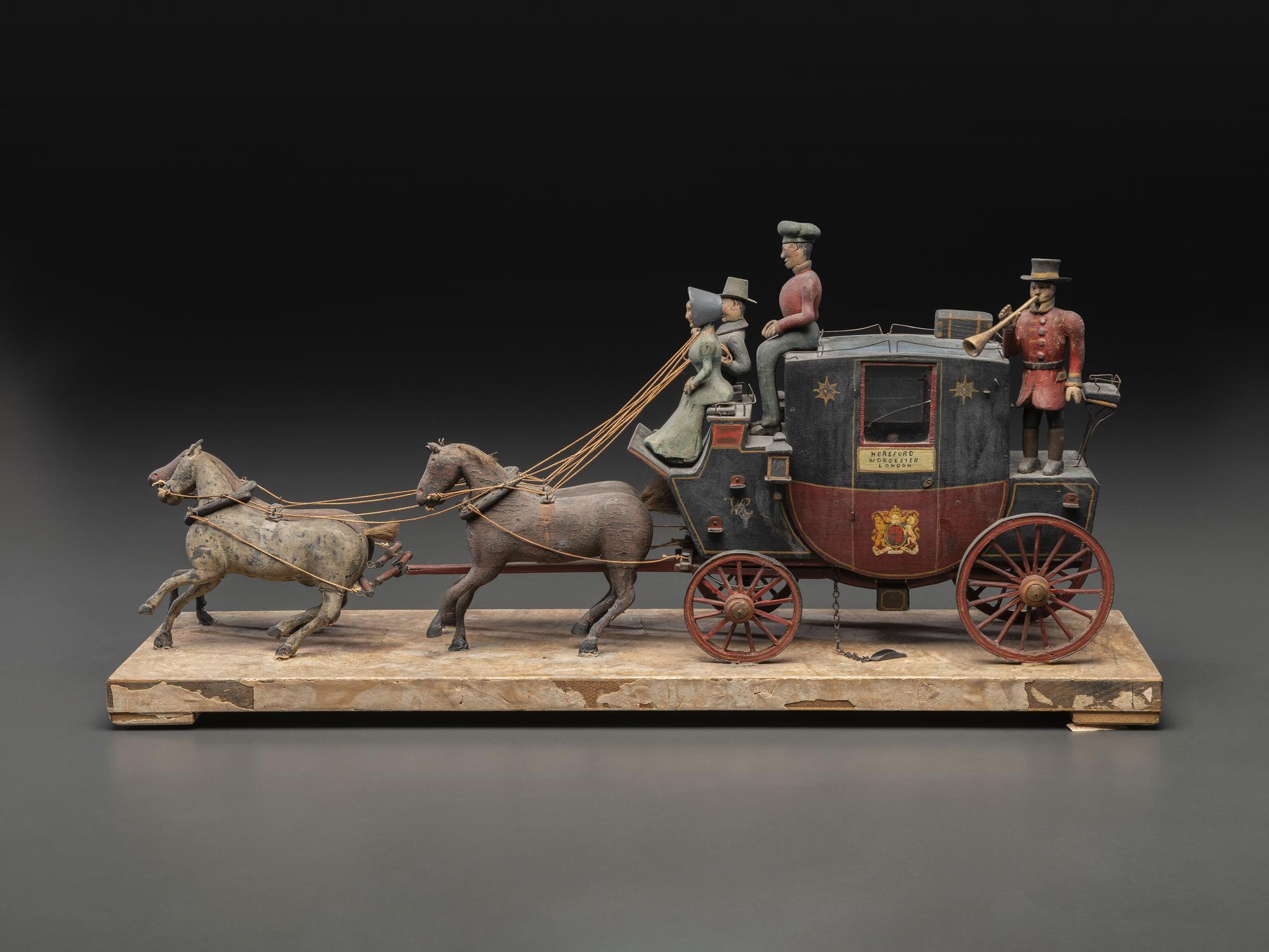 A Folk Art Carved and Painted Wood English Royal Stagecoach