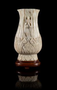 A Chicken Bone Jade Vase Height 8 inches.