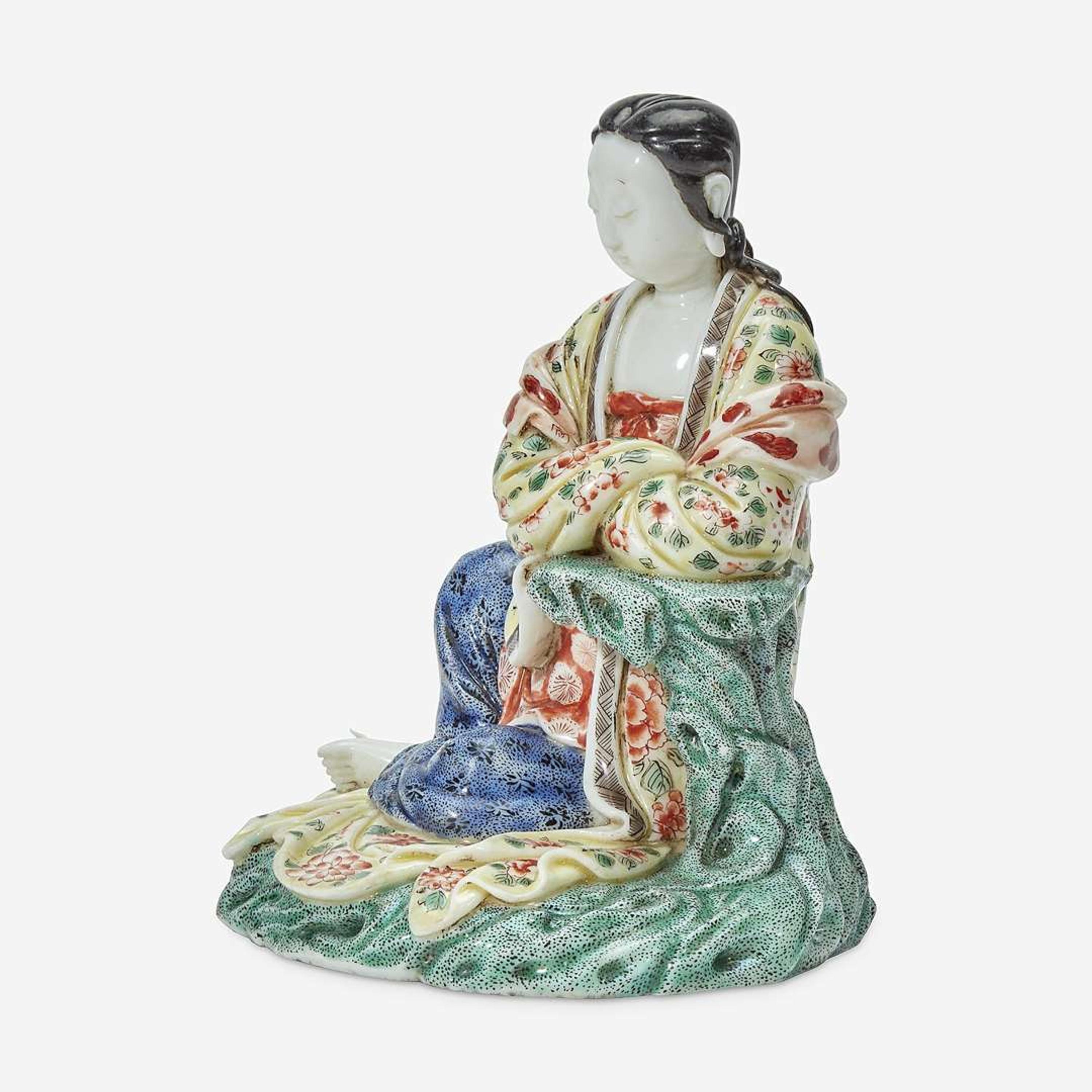 A Chinese enameled Dehua porcelain figure of Guanyin seated 18th Century, later decorated