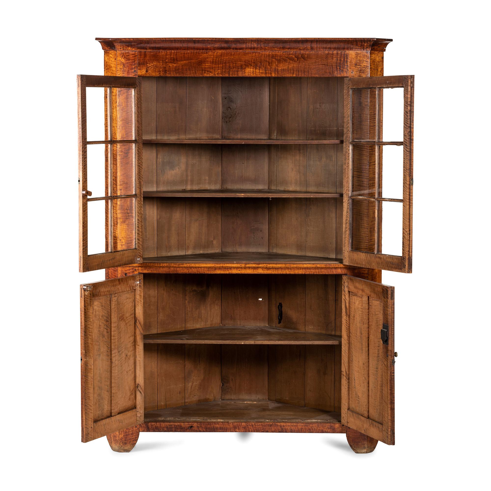 A Chippendale Tiger Maple Corner Cupboard