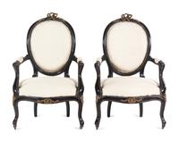 A Pair of Napoleon III Gilt Metal Mounted Ebonized Fauteuils