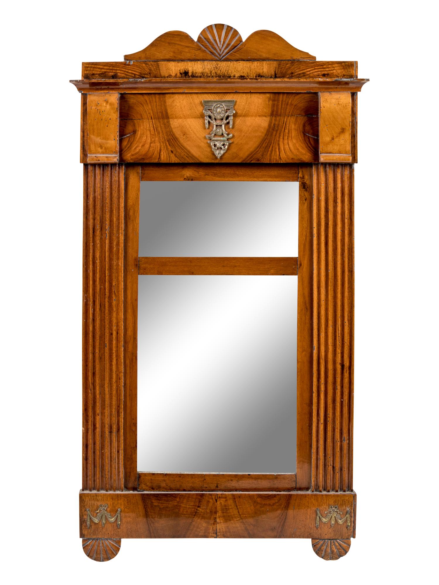 A Continental Carved Mahogany Mirror