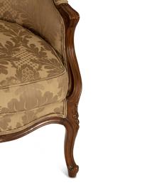 A Louis XV Style Carved Walnut Bergère