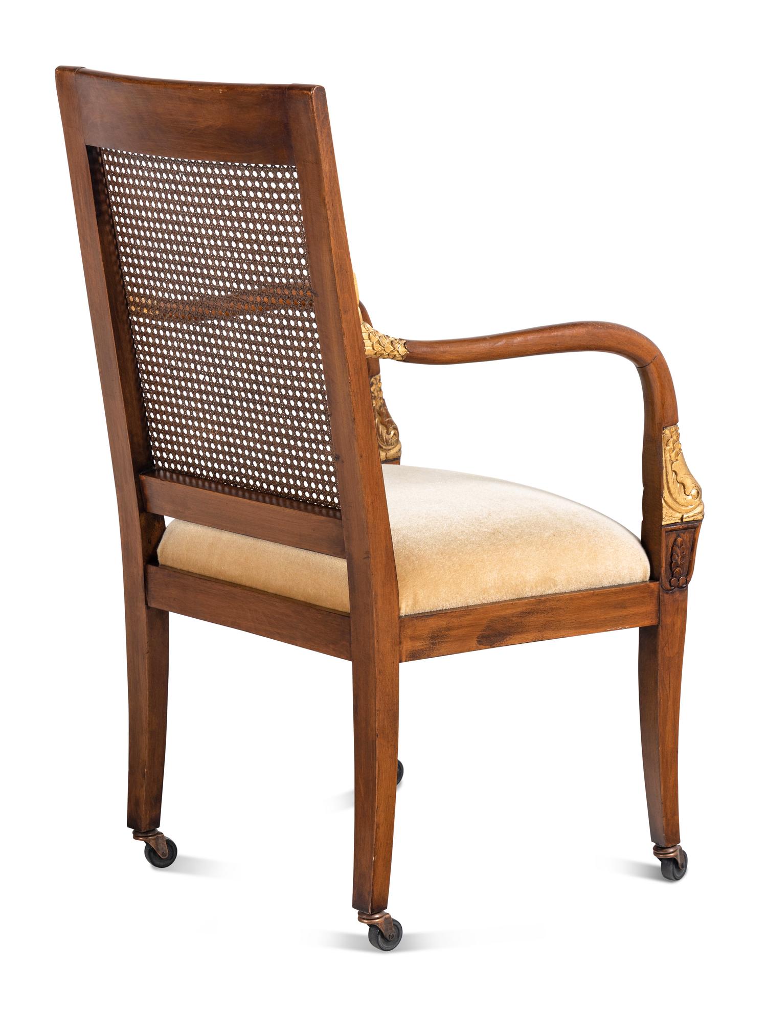 A Set of Four Baltic Style Parcel Gilt Walnut Armchairs