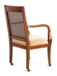 A Set of Four Baltic Style Parcel Gilt Walnut Armchairs