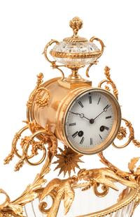 A Louis XV Style Gilt Bronze and Cut Glass Clock