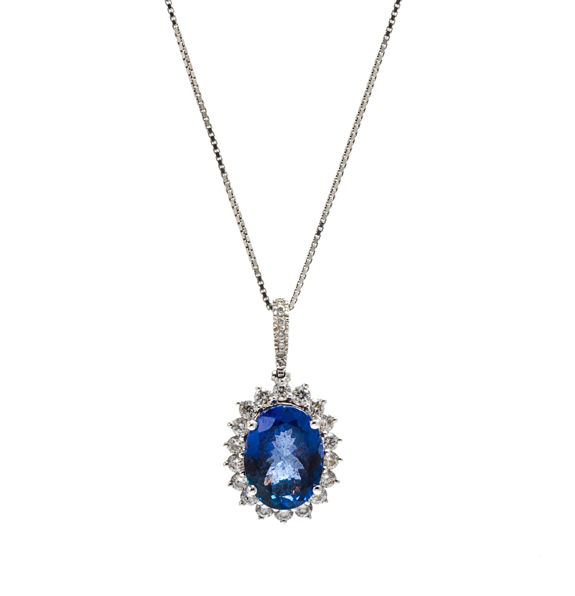 An 18 Karat White Gold, Tanzanite and Diamond Pendant, 4.70 dwts.