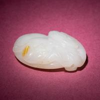 A Small Chinese Russet and Jade 'Bat and Lingzhi' Carving, 18th/19th Century — 清中期 白玉留皮靈芝福壽佩