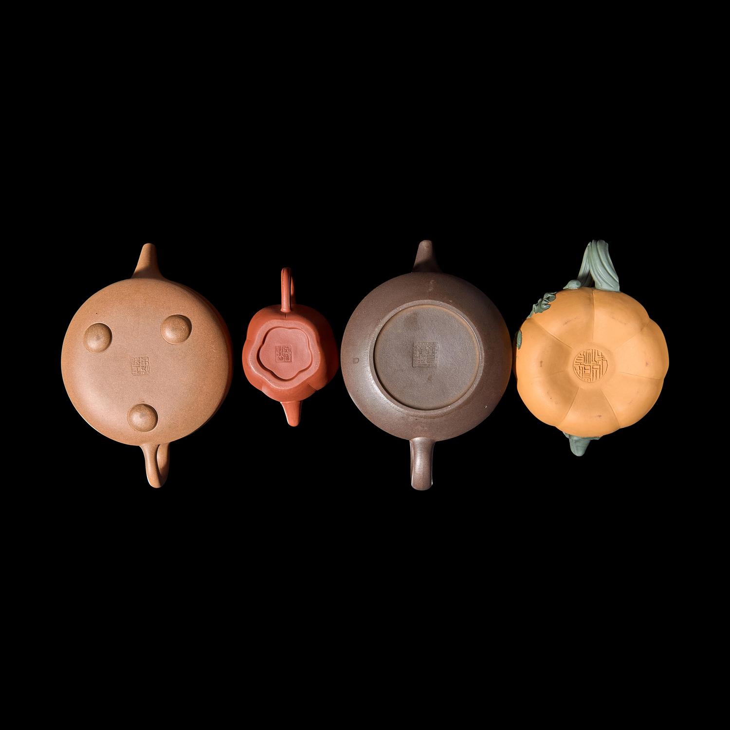 A Group of Eight Assorted Yixing Zisha Stoneware Teapots 宜興紫砂茶壺八件