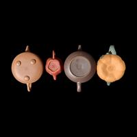 A Group of Eight Assorted Yixing Zisha Stoneware Teapots 宜興紫砂茶壺八件