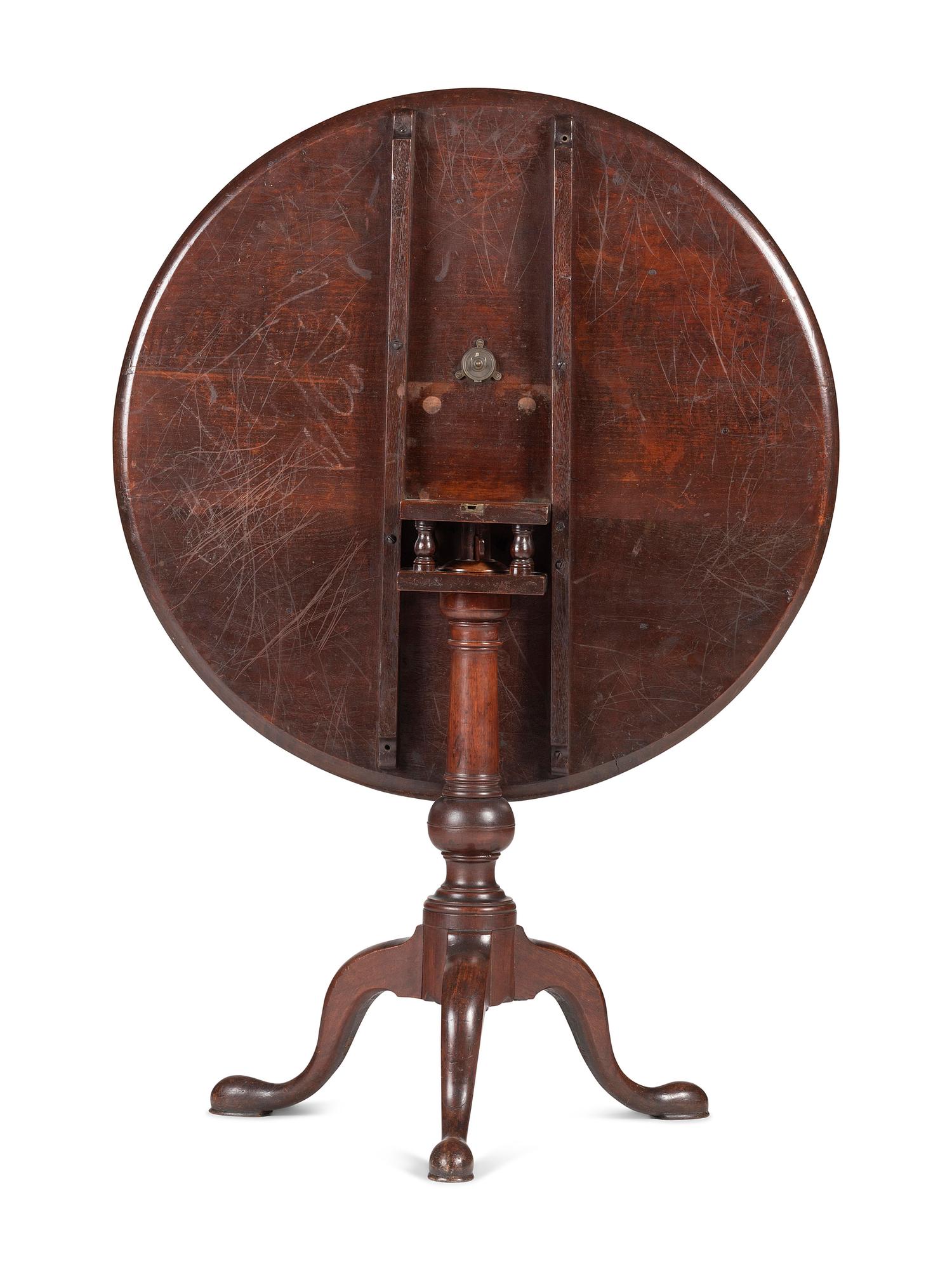 A Chippendale Carved and Figured Mahogany Tilt-Top Tea Table