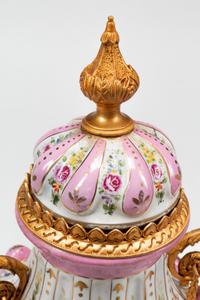A Pair of Sèvres Style Gilt Bronze Mounted Porcelain Urns