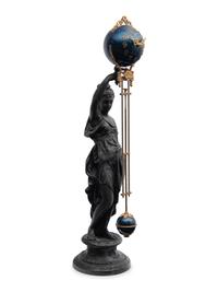 A Continental Cast Metal and Enameled Figural Pendulum Clock