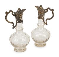 Two Continental Pewter Mounted Glass Claret Jugs