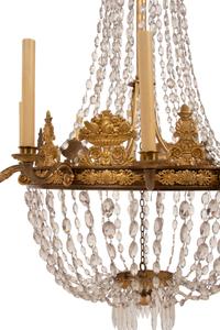 An Empire Gilt Bronze and Cut Glass Twelve-Light Chandelier