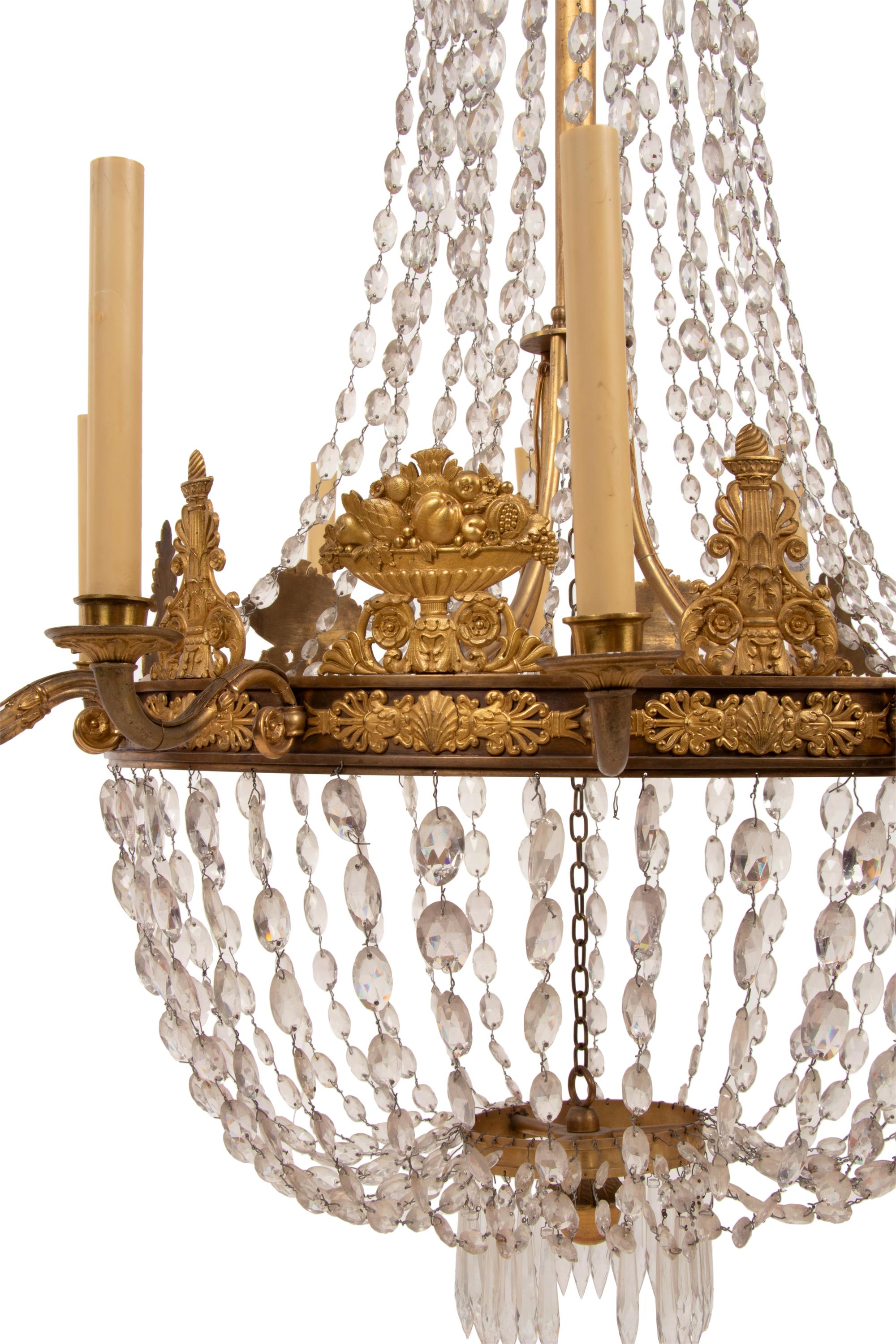 An Empire Gilt Bronze and Cut Glass Twelve-Light Chandelier