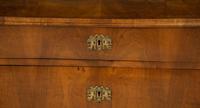 A Continental Walnut Chest of Drawers