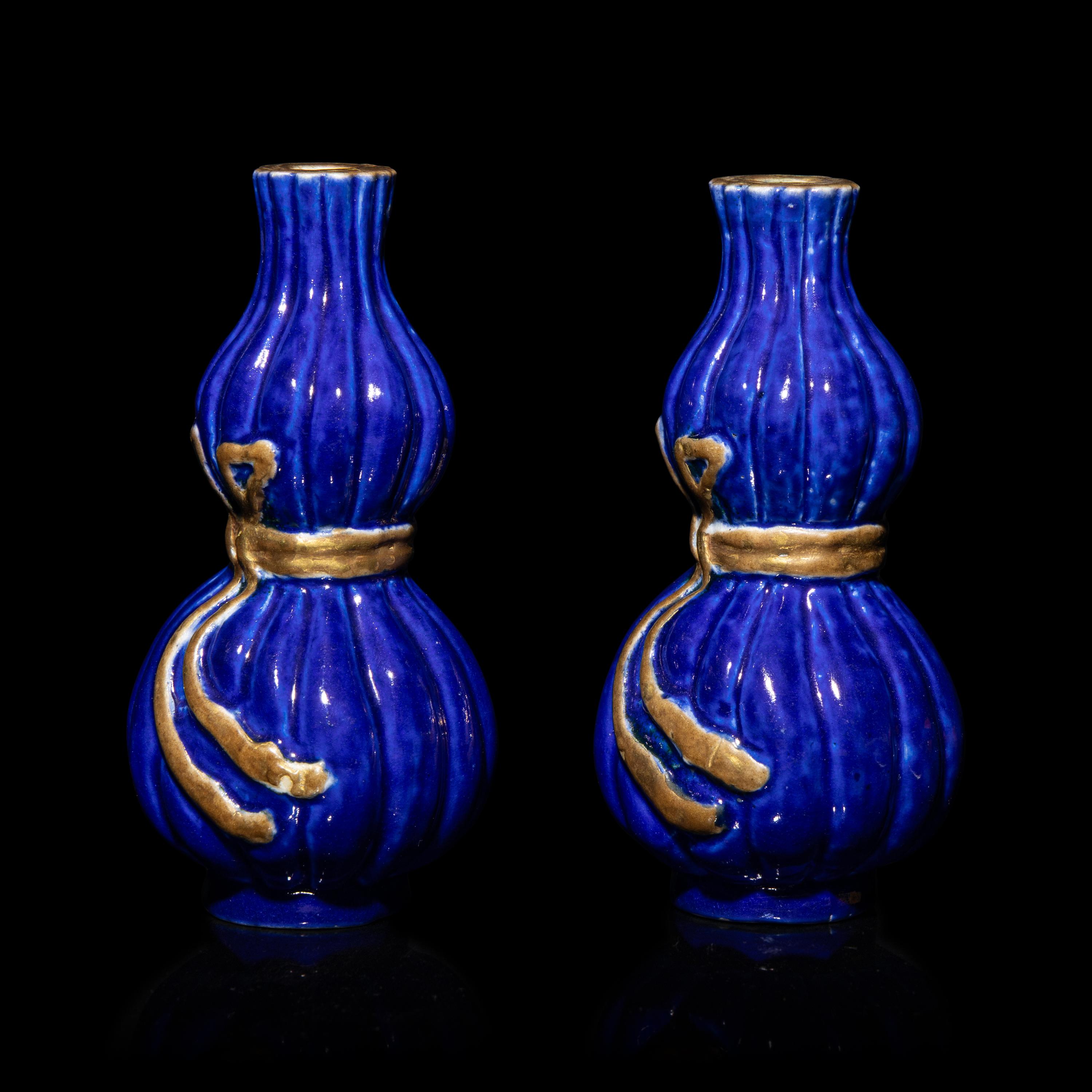 A Pair of Chinese Gilt Decorated Blue Glazed Porcelain Gourd Vases, 20th Century — 霽藍釉描金葫蘆式包袱瓶一對