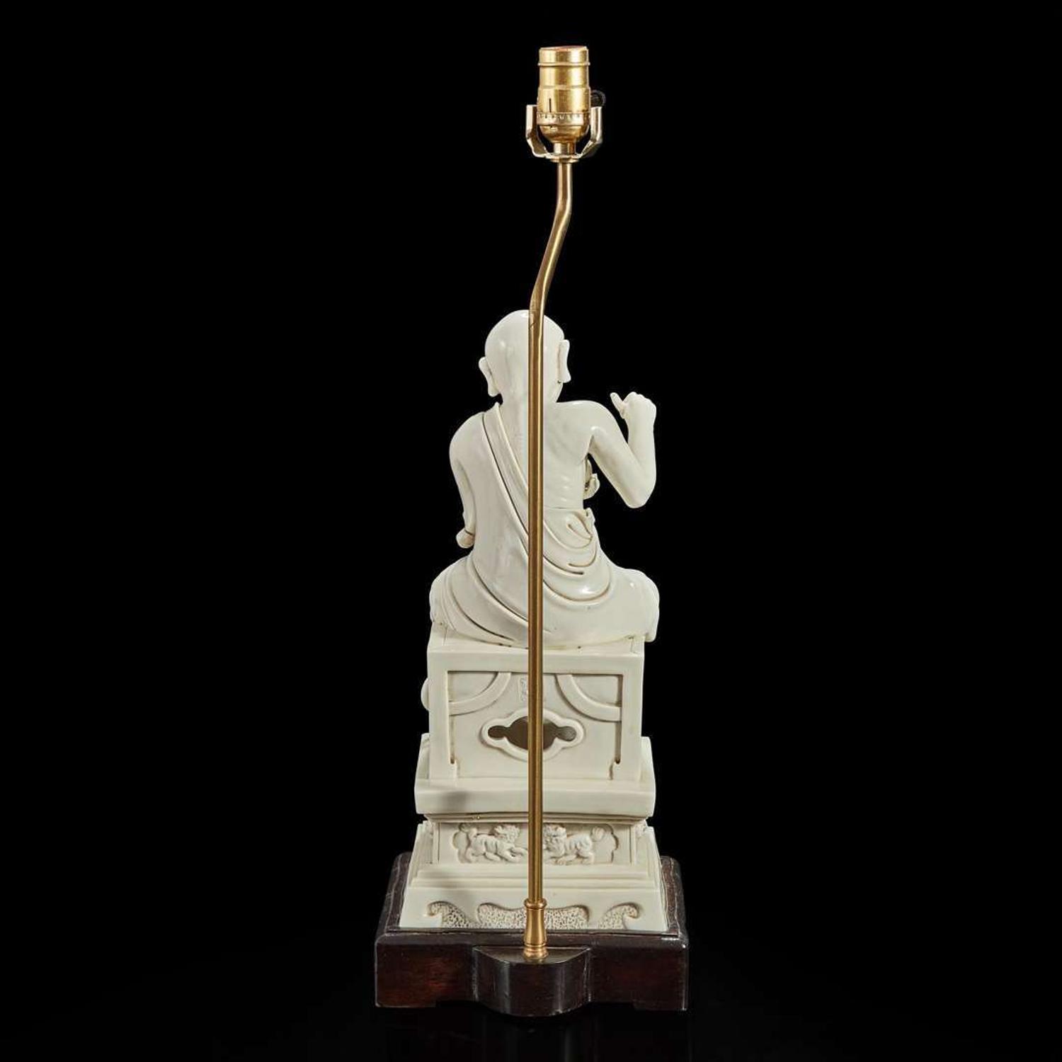 A large Chinese Dehua porcelain figure of a seated luohan