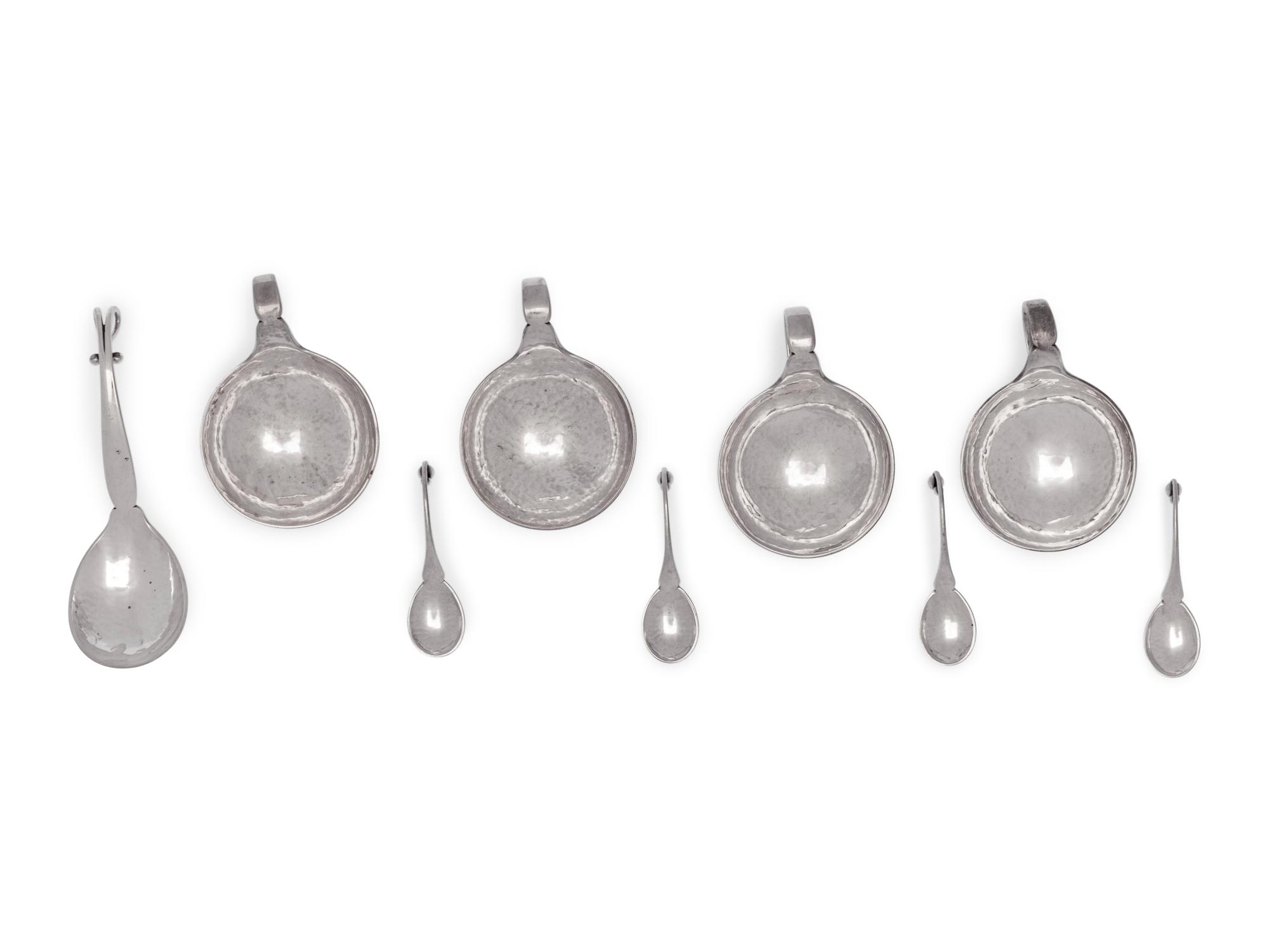 A Set of Four Georg Jensen Silver Salt Cellars and Spoons