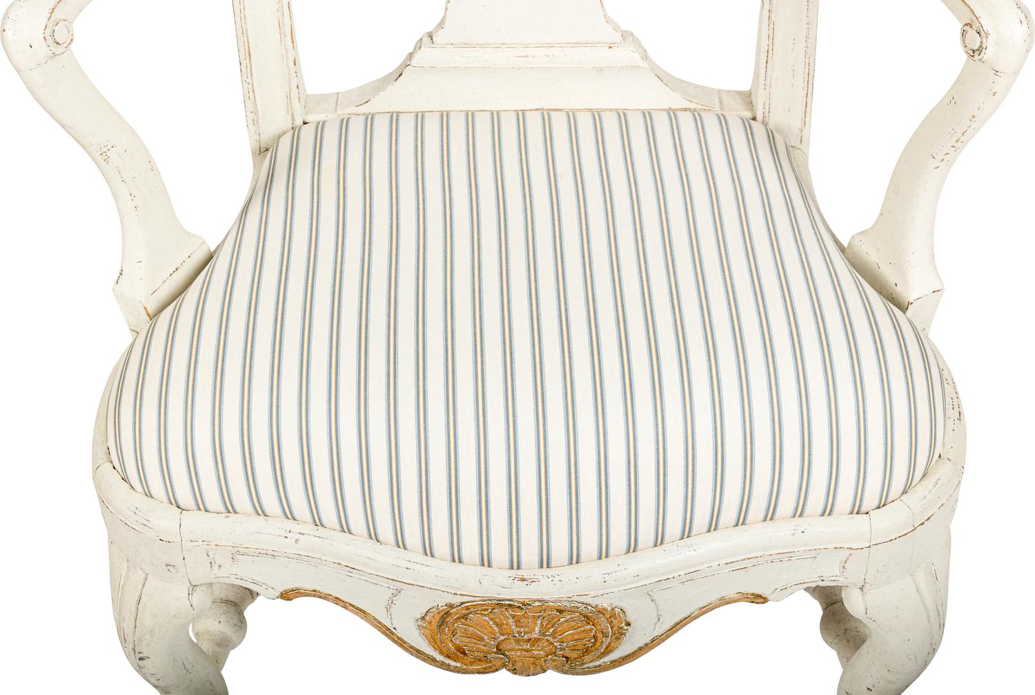 A Pair of Swedish White-Painted and Parcel-Gilt Open Armchairs