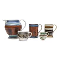 Group of five variously decorated Mochaware items English, early 19th century
