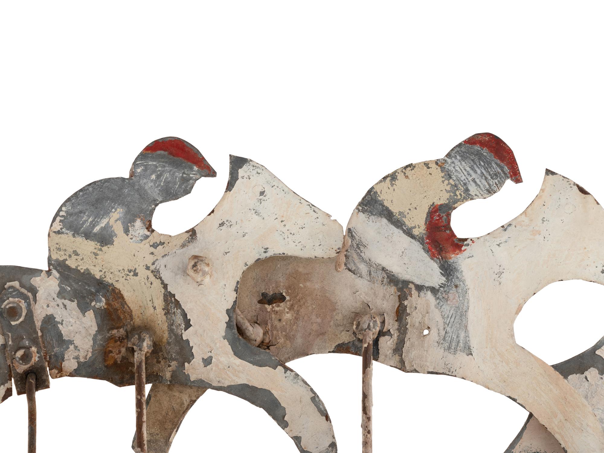 A Cut and Painted Metal and Wood Horse Race Directional Whirlgig