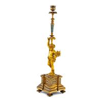 A French Gilt Bronze and Champlevé Figural Candlestick