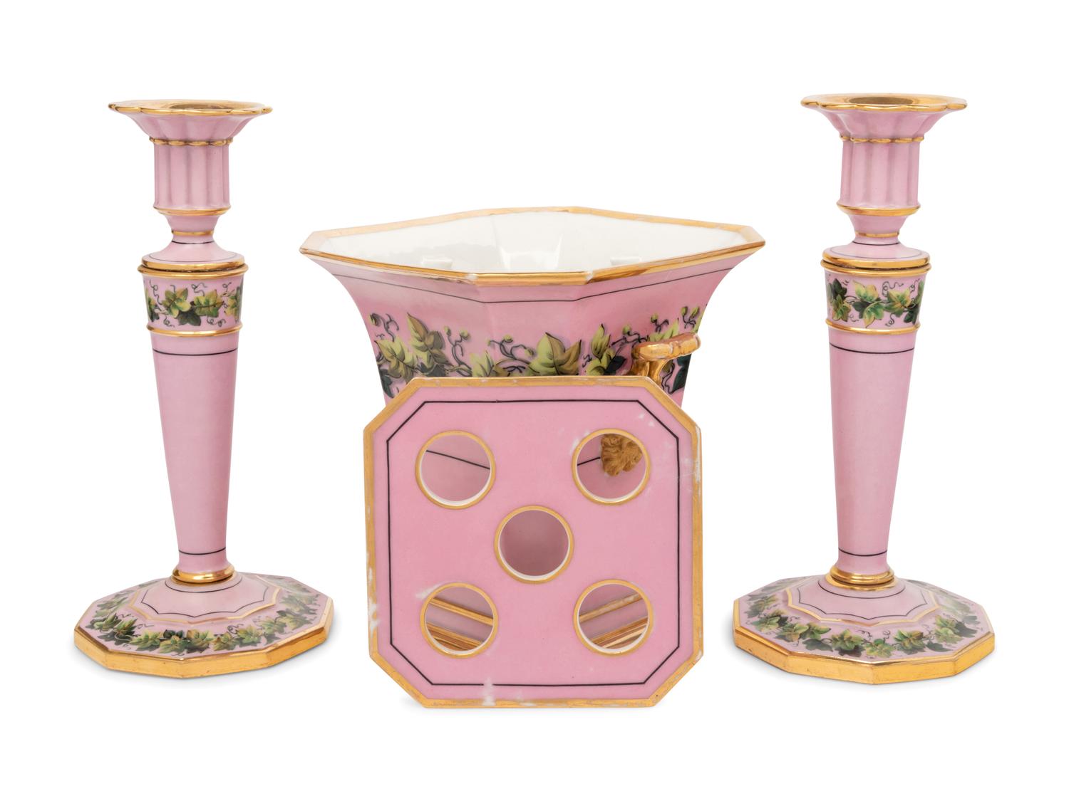 A Pair of Paris Porcelain Pink-Ground Vine-Decorated Candlesticks and a Jardinière