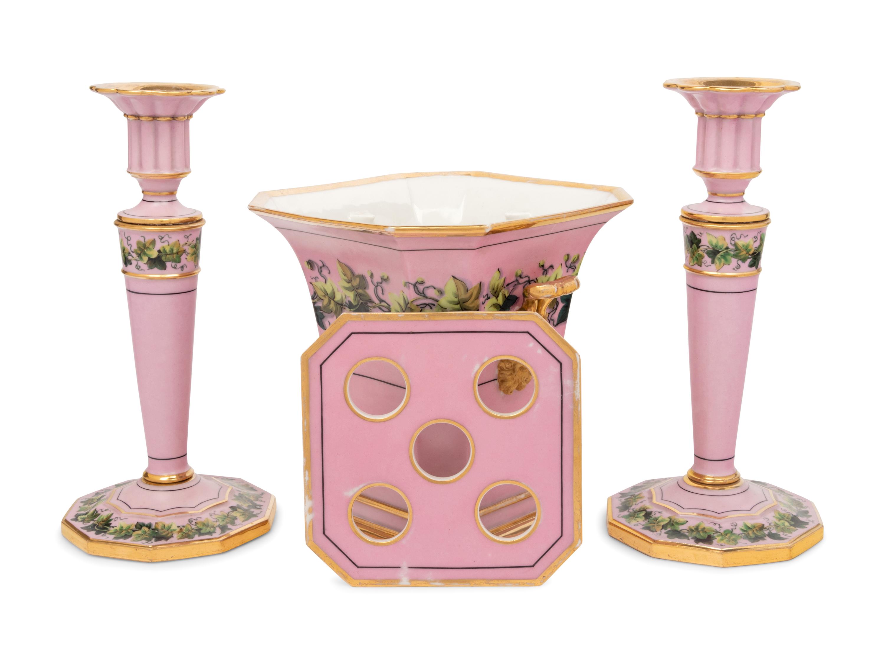 A Pair of Paris Porcelain Pink-Ground Vine-Decorated Candlesticks and a Jardinière