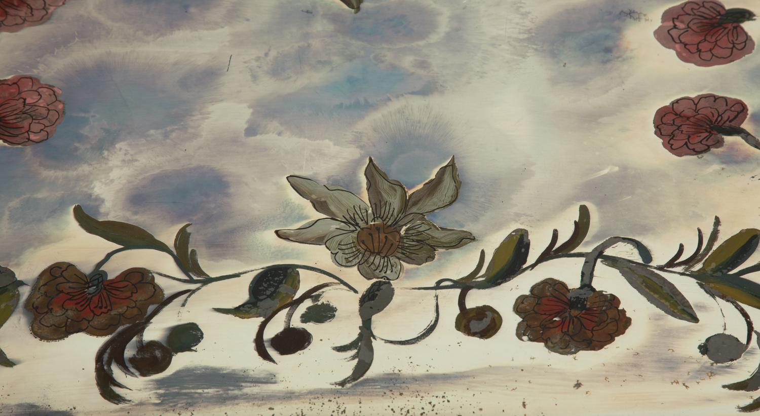 An Eglomisé Mirrored Coffee Table with Floral Decoration
