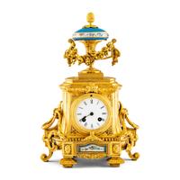 A French Gilt-Metal and Porcelain-Inset Mantel Clock