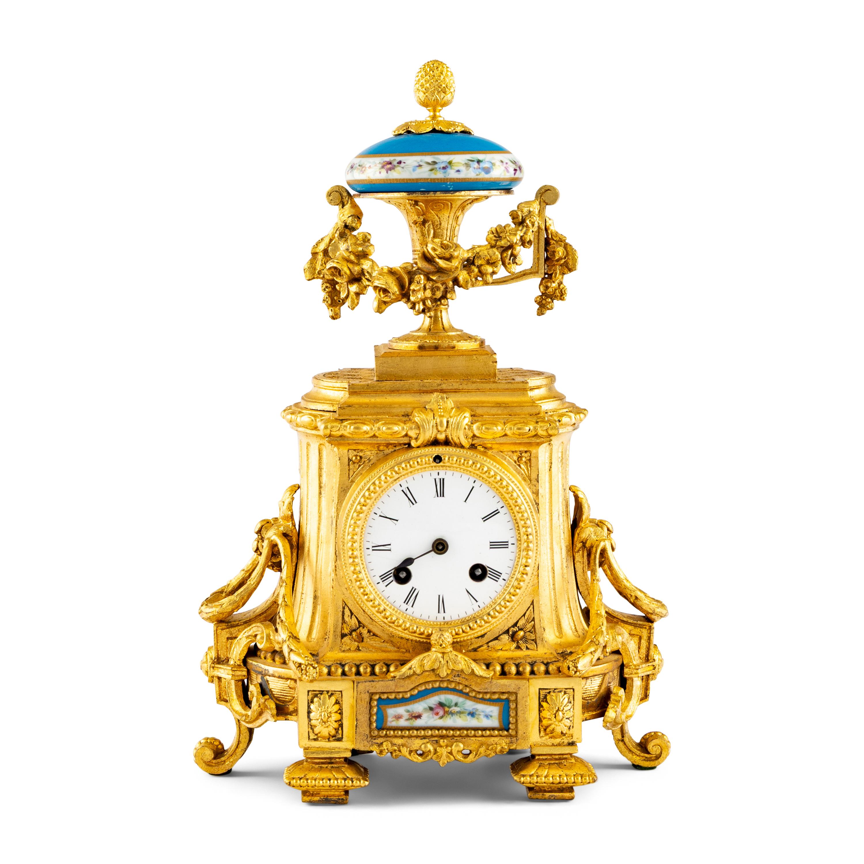 A French Gilt-Metal and Porcelain-Inset Mantel Clock
