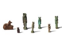 Seven Egyptian Faience and Stone Anubis Amulets