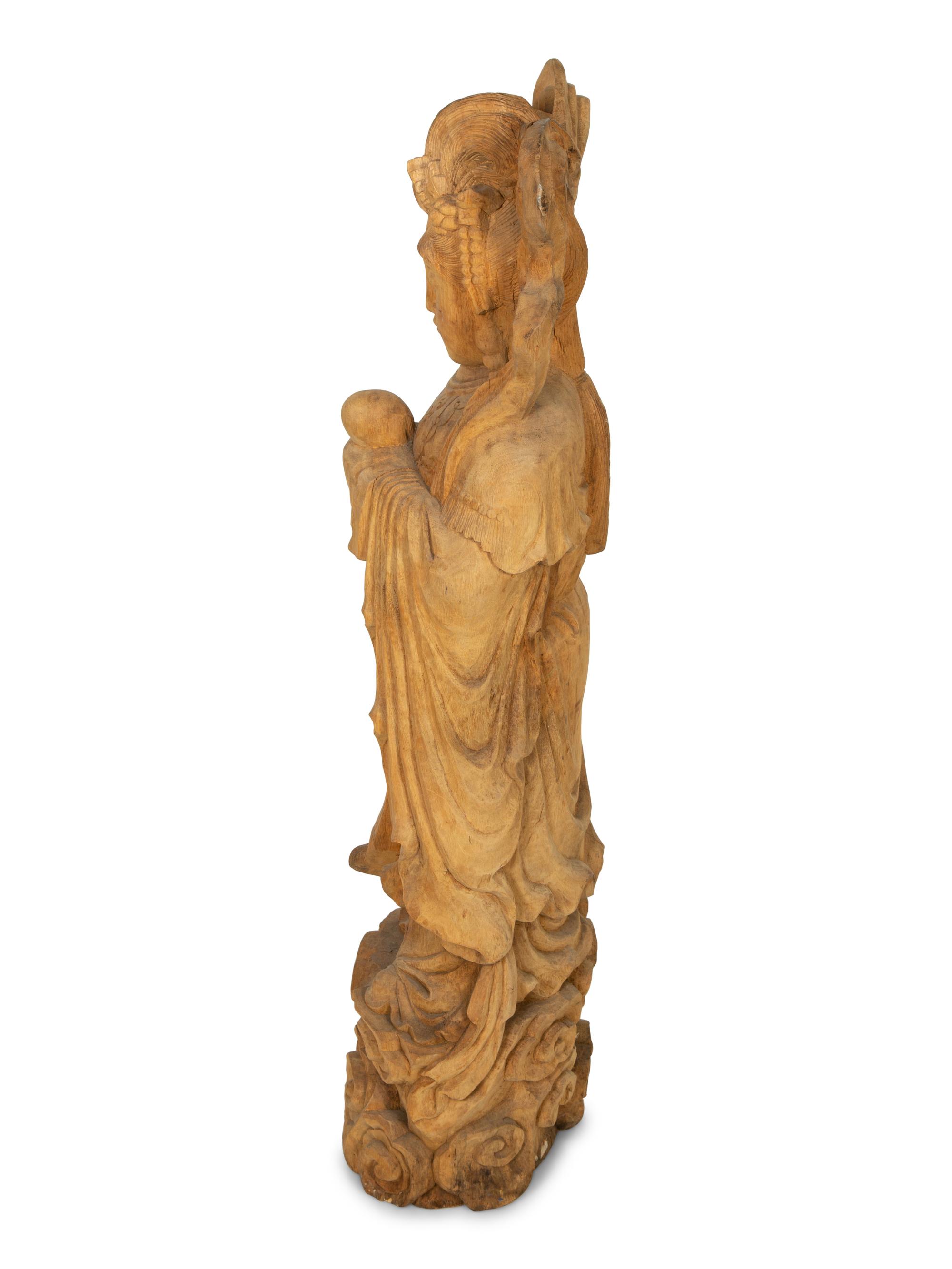 A Carved Wood Figure of Guanyin