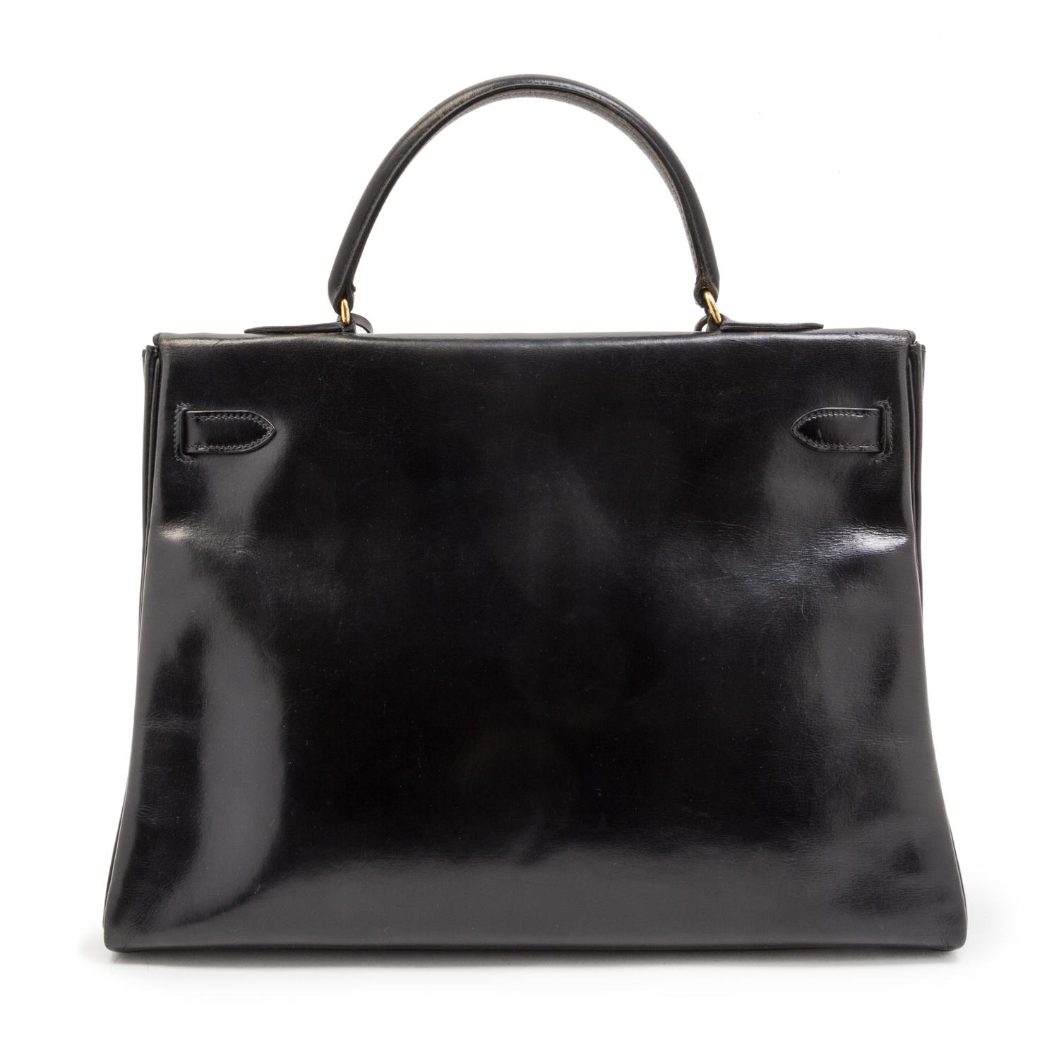 An Hermes 35cm Black Leather Kelly Bag, 13 1/2 x 9 1/2 x 5 inches.