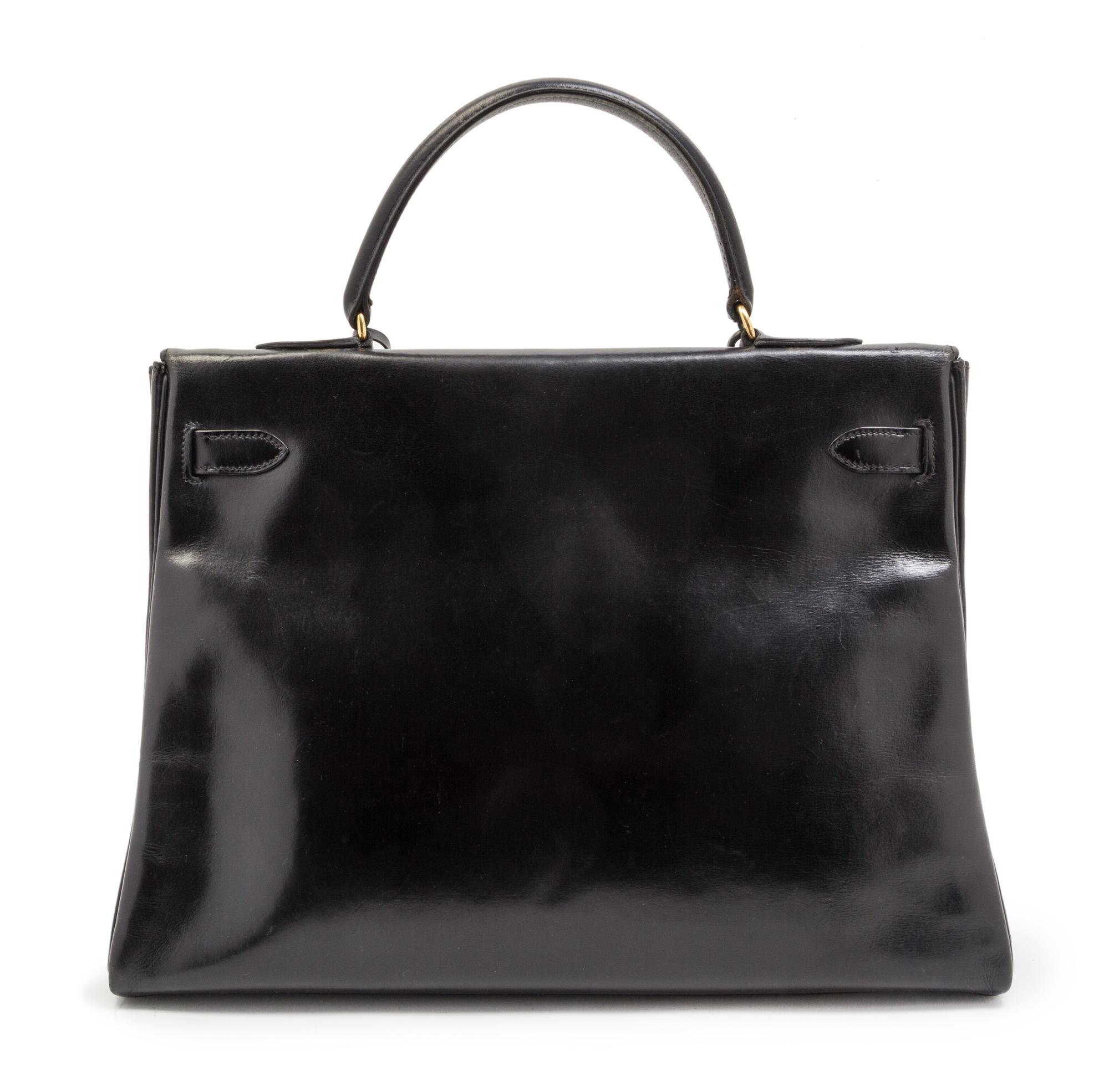 An Hermes 35cm Black Leather Kelly Bag, 13 1/2 x 9 1/2 x 5 inches.