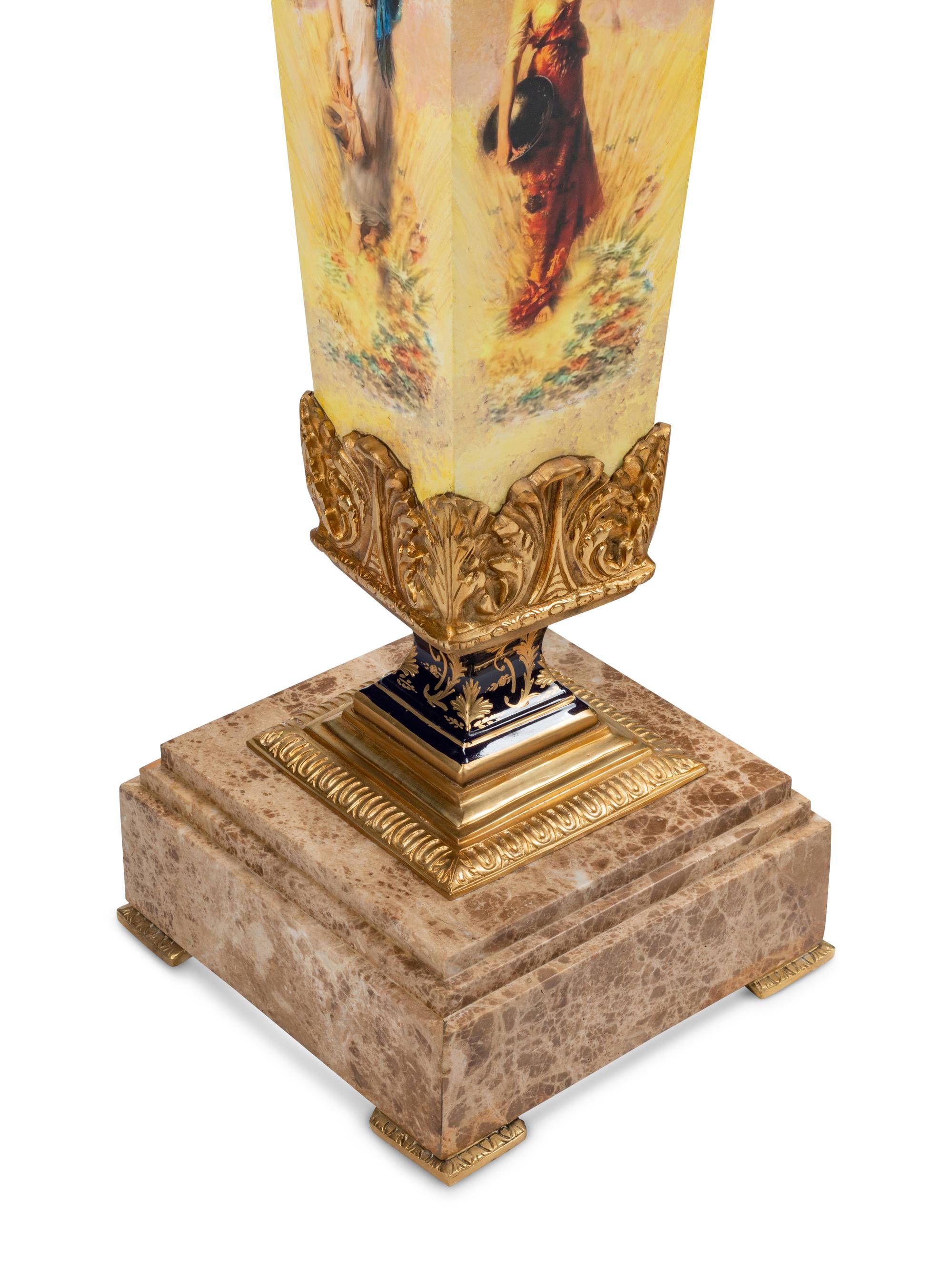 A Pair of Continental Gilt and Transfer-Printed Metal Mounted Marble Pedestals