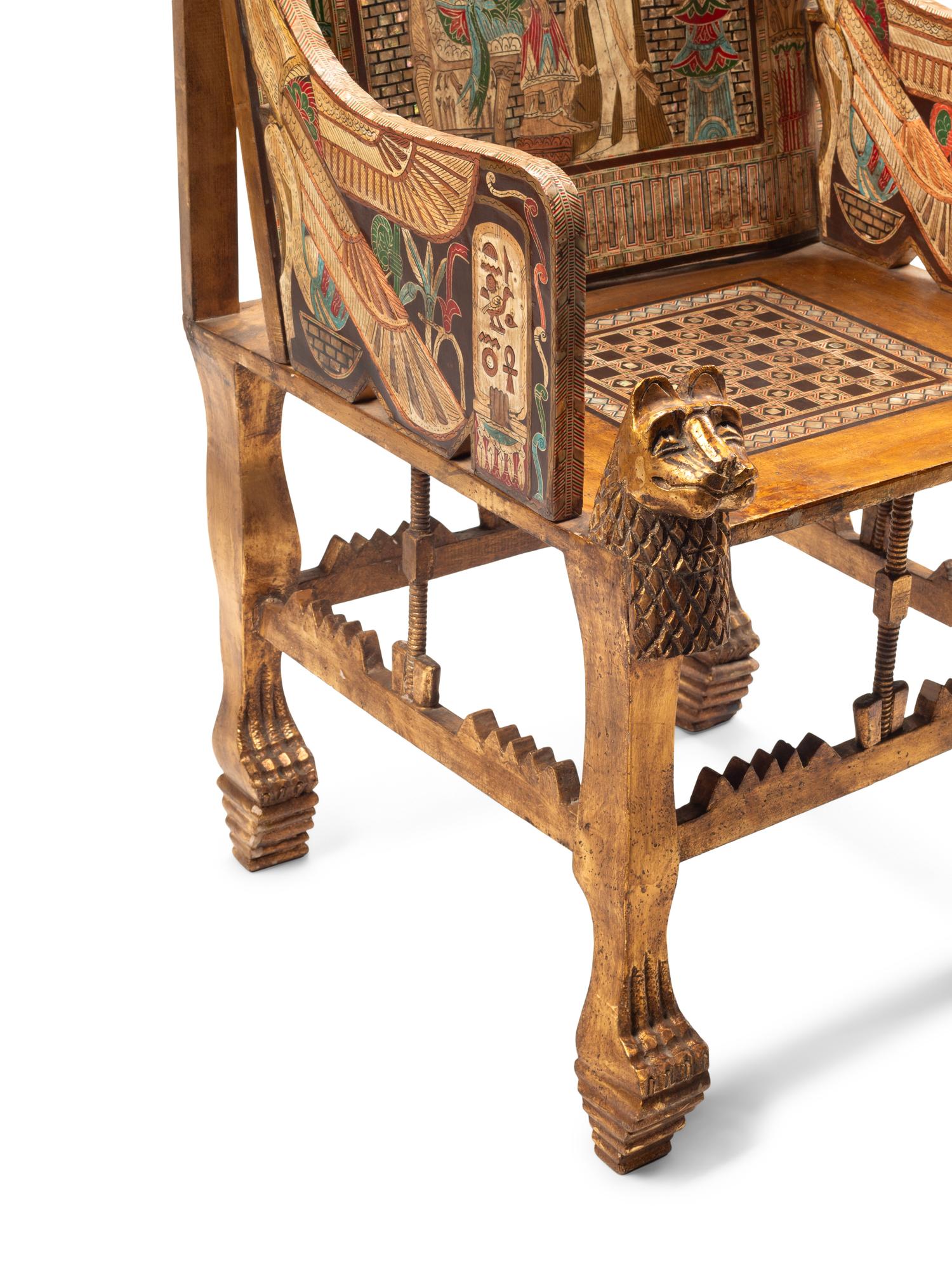An Egyptian Style Painted Giltwood and Mother-of-Pearl Inlaid Throne Chair