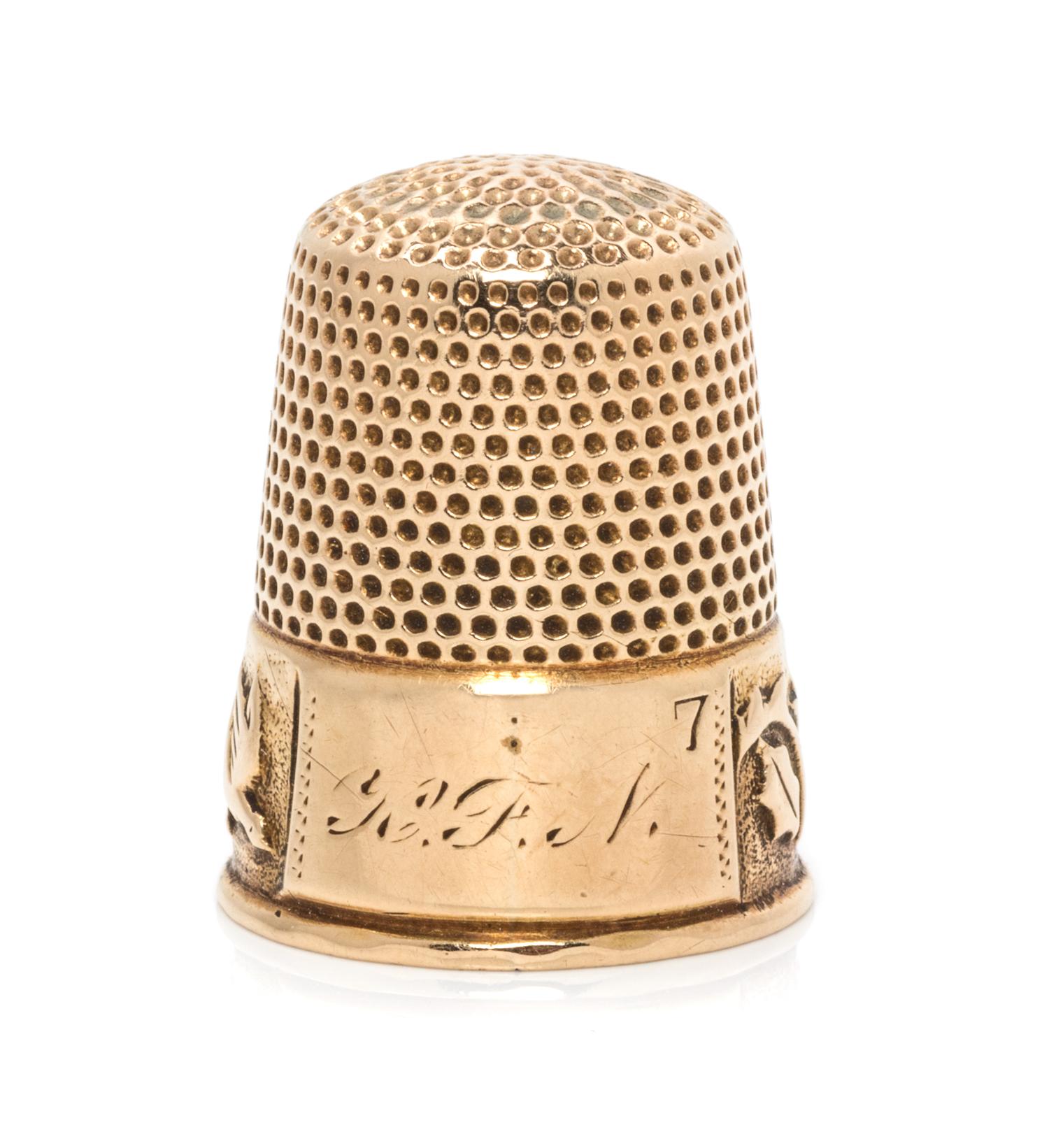 An American 14-Karat Yellow Gold Thimble, Ketcham & McDougall, New York, NY, 19th Century, the knurled top and body above a foliate, vi