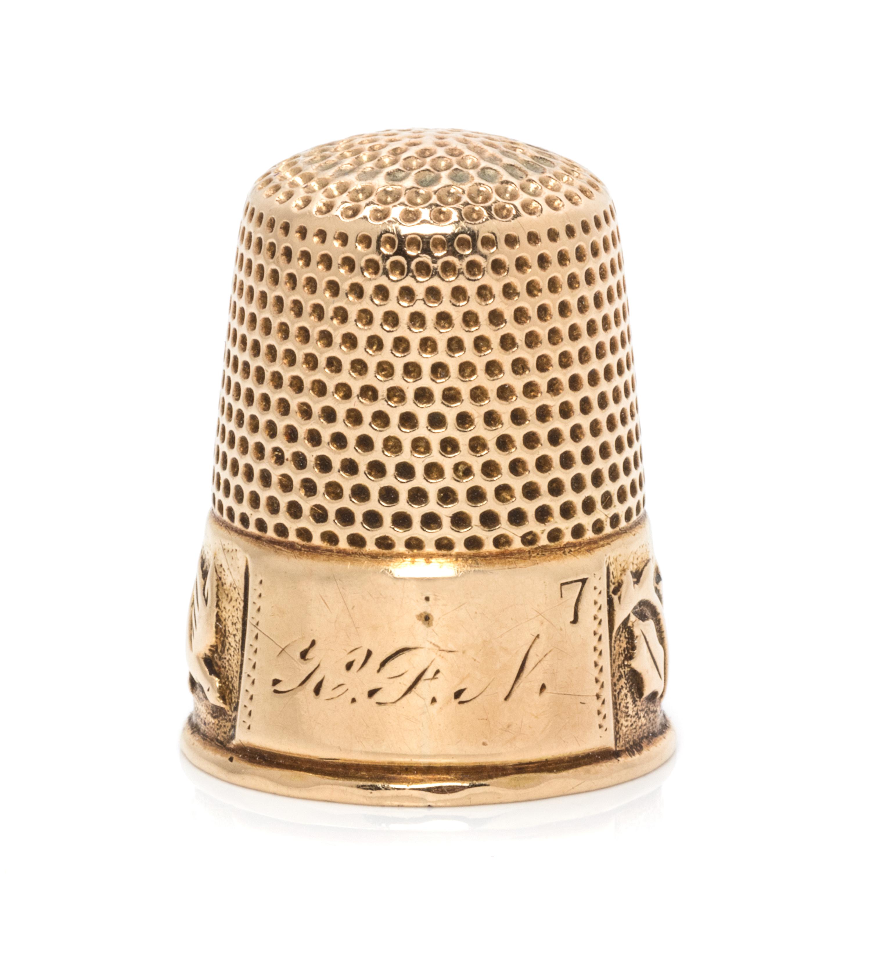 An American 14-Karat Yellow Gold Thimble, Ketcham & McDougall, New York, NY, 19th Century, the knurled top and body above a foliate, vi
