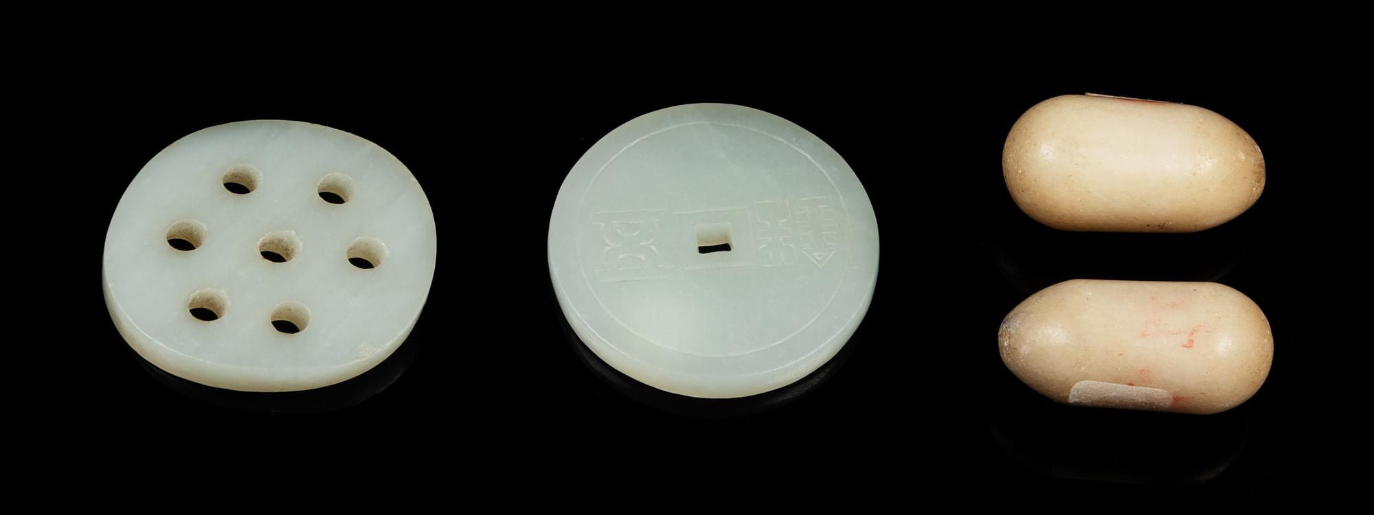Four Chinese Jade Carvings Diameter of largest 2 inches. — QING DYNASTY (1644-1911)