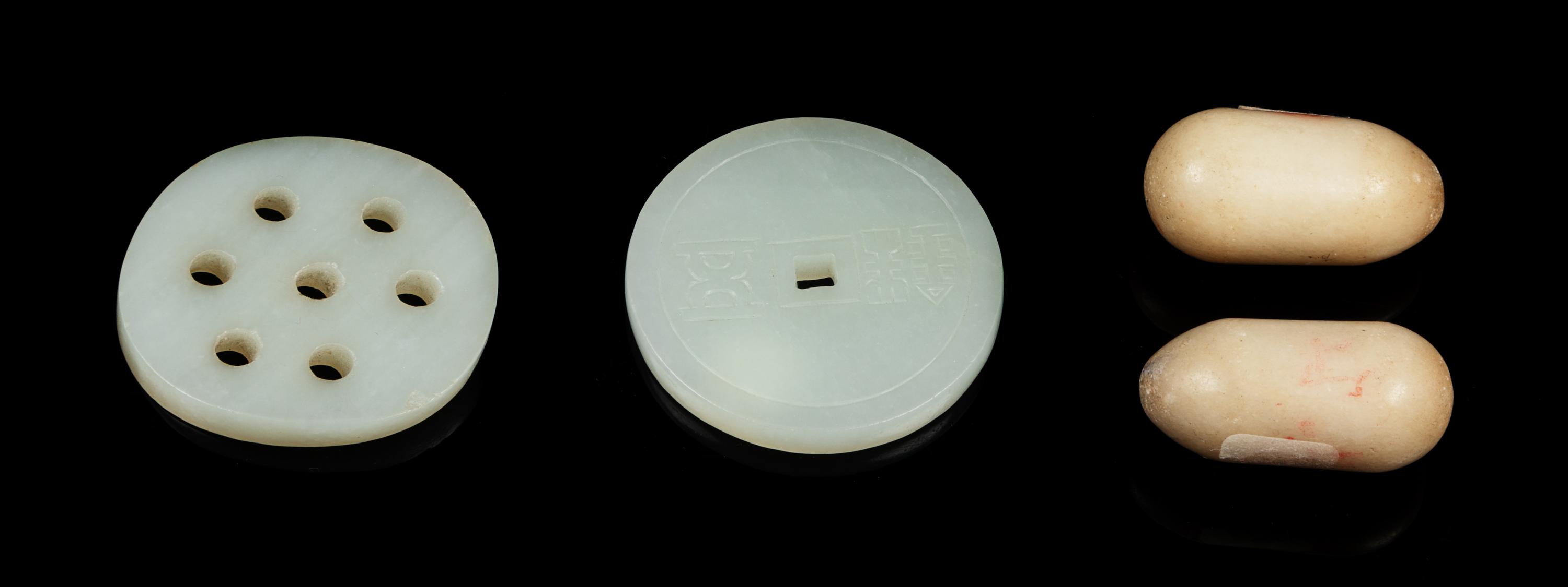 Four Chinese Jade Carvings Diameter of largest 2 inches. — QING DYNASTY (1644-1911)