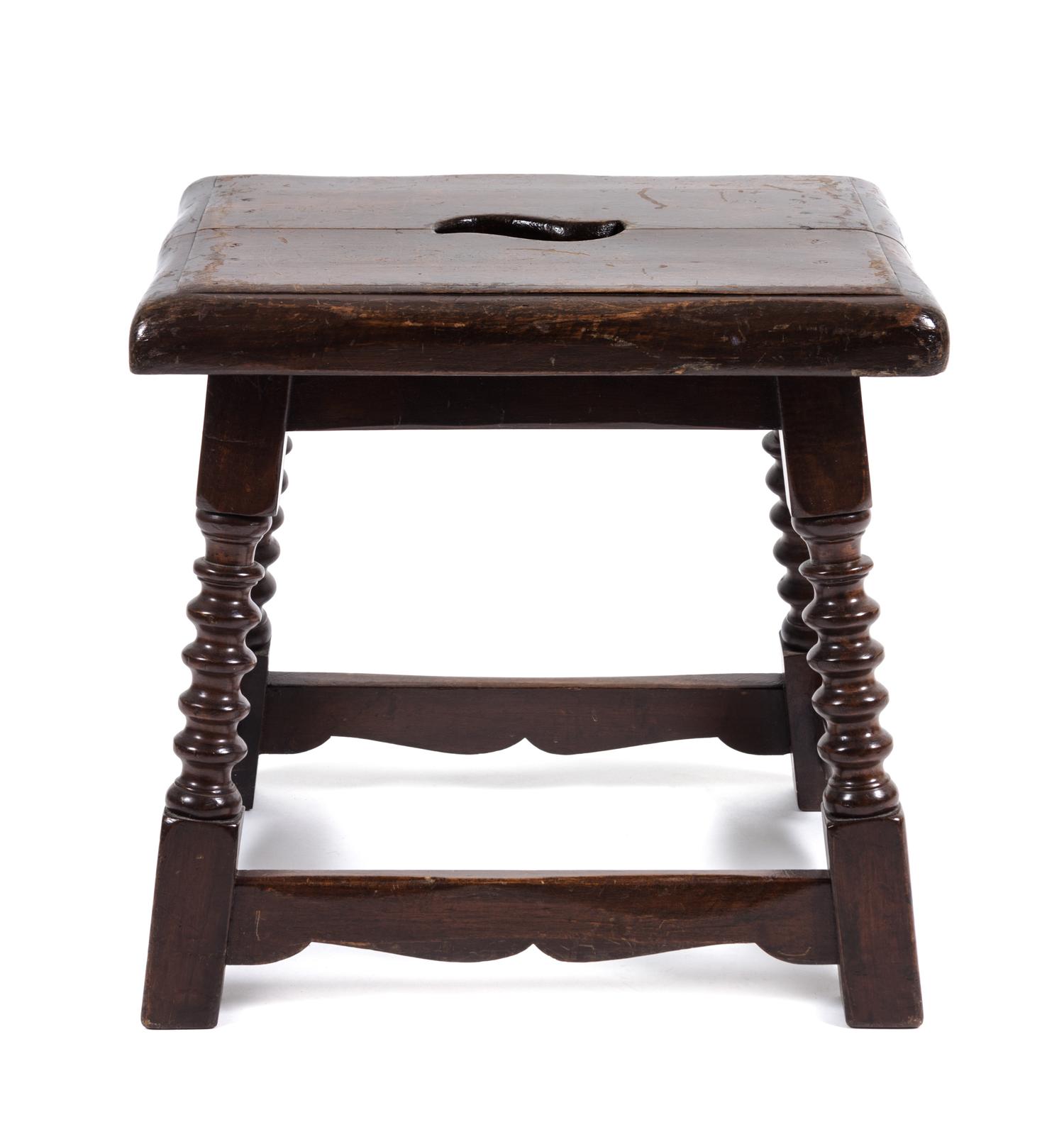 A Jacobean Style Walnut Stool Height 17 x width 17 1/2 x depth 14 inches.